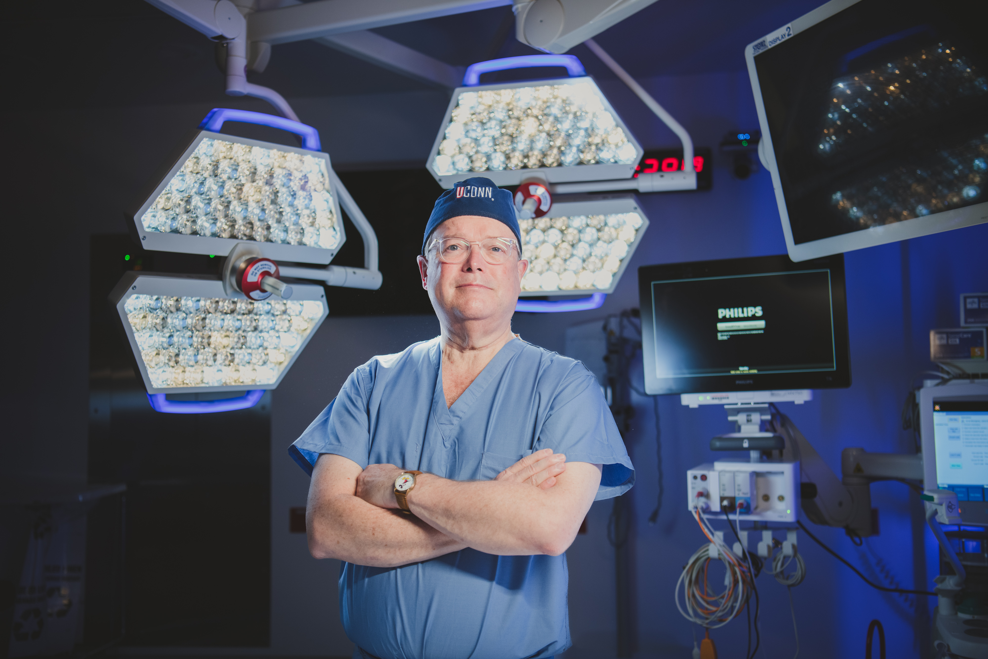 Dr. Crombleholme proudly stands in the OR