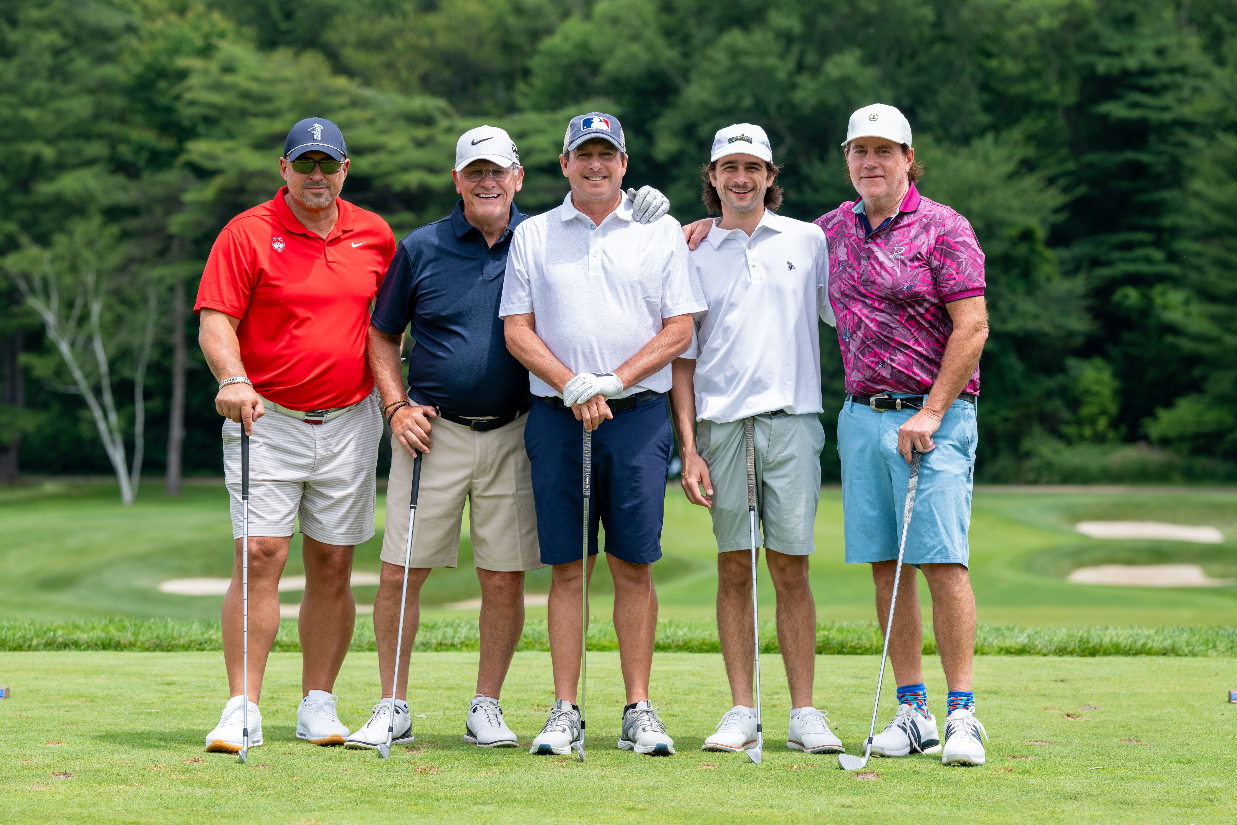 Geno and a team of golfers