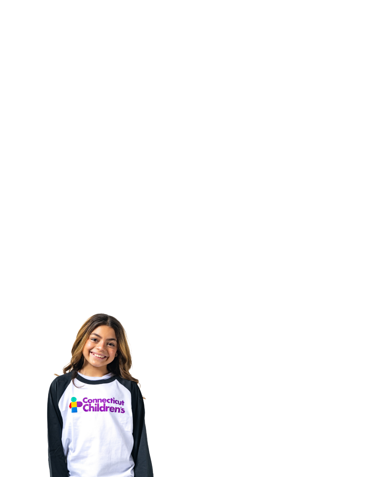 Daniela smiling wearing her Connecticut Children's shirt