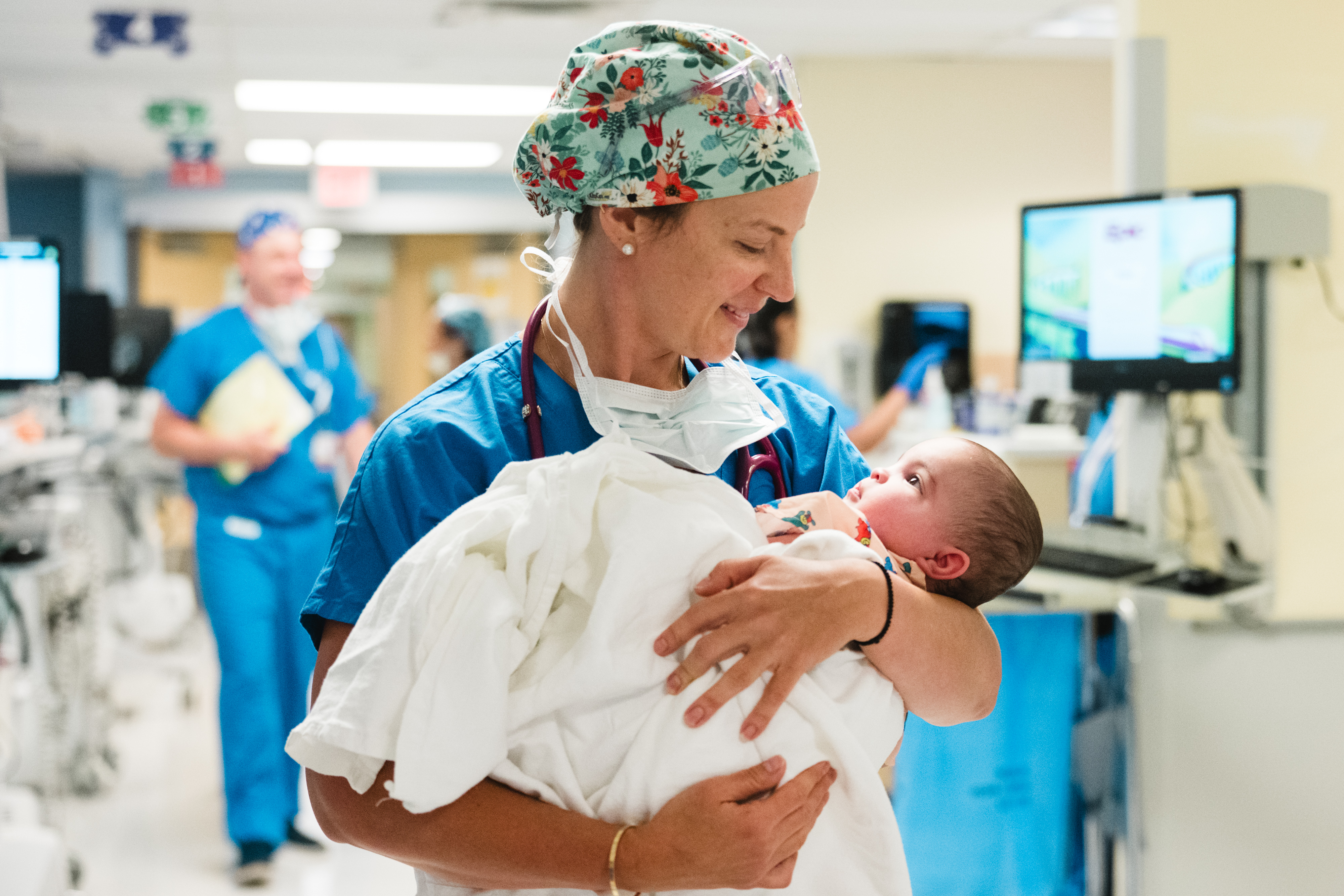 Anesthesiologist holds infant