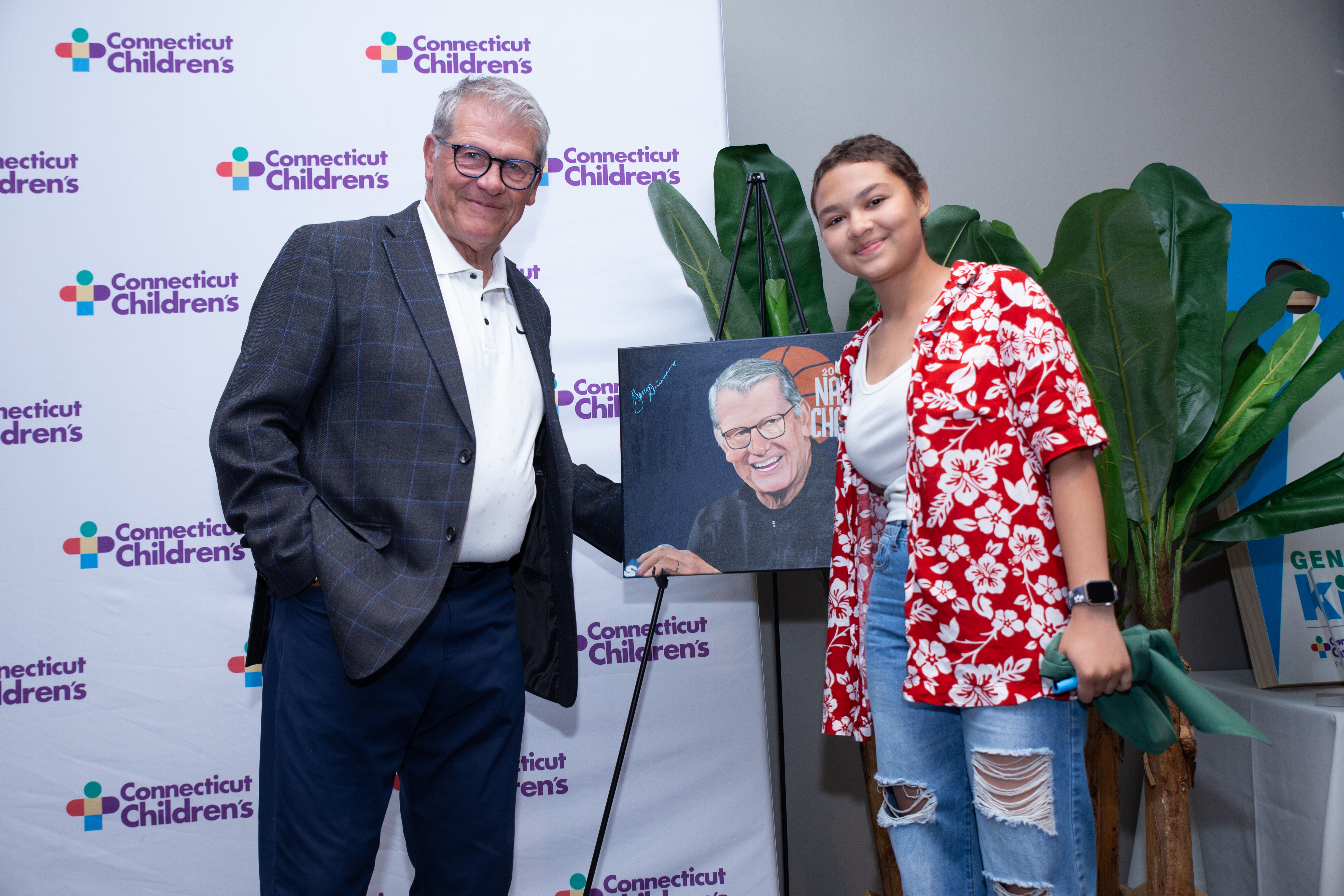Geno and Ana smiling with painting