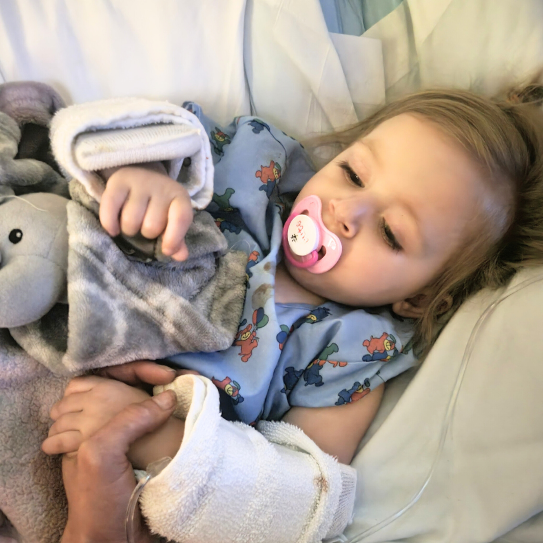 Anastasia laying in her hospital bed