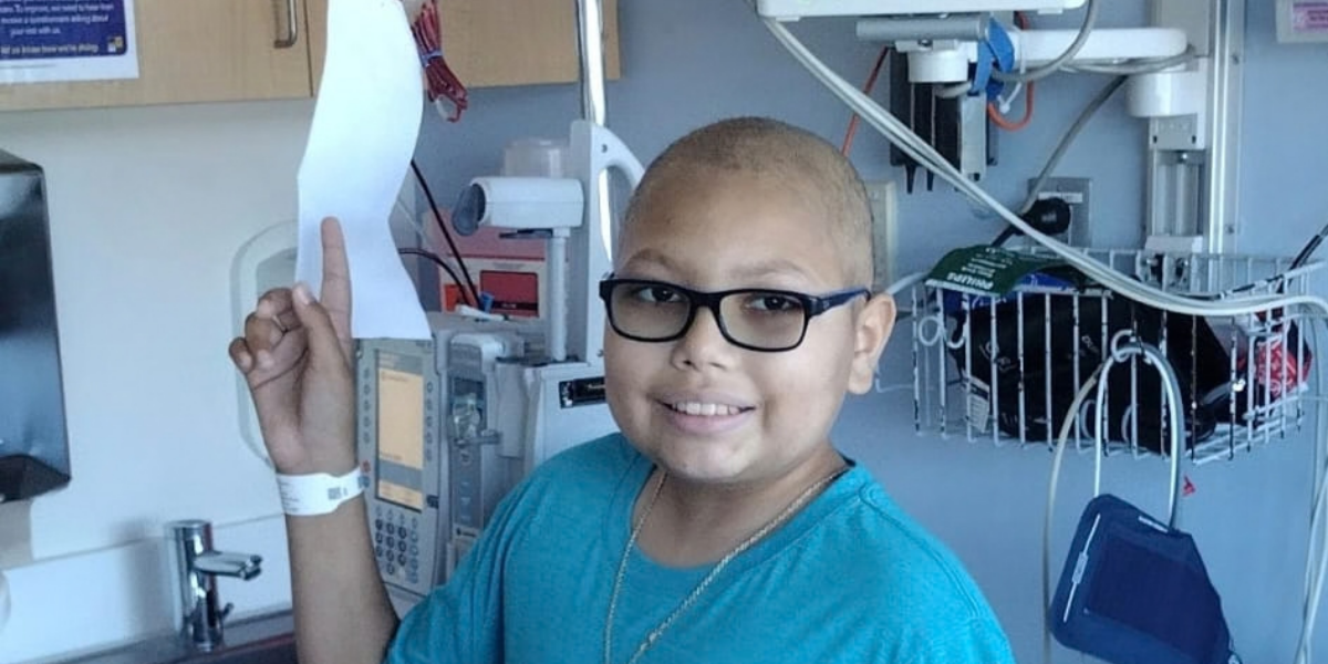 Elijah smiling in hospital during treatment