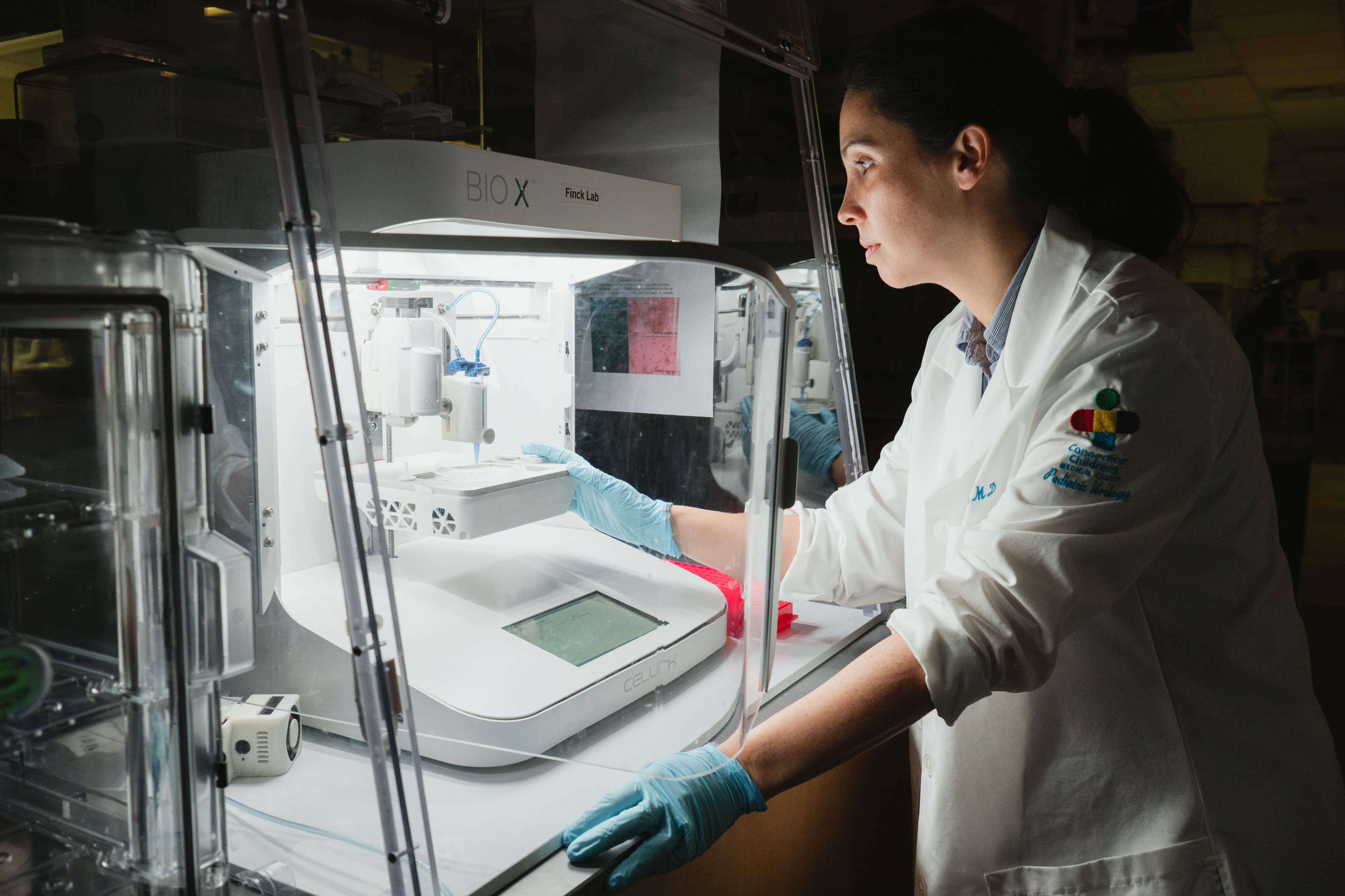 Dr. Rowe in the research lab conducting research using the 3D Bioprinter