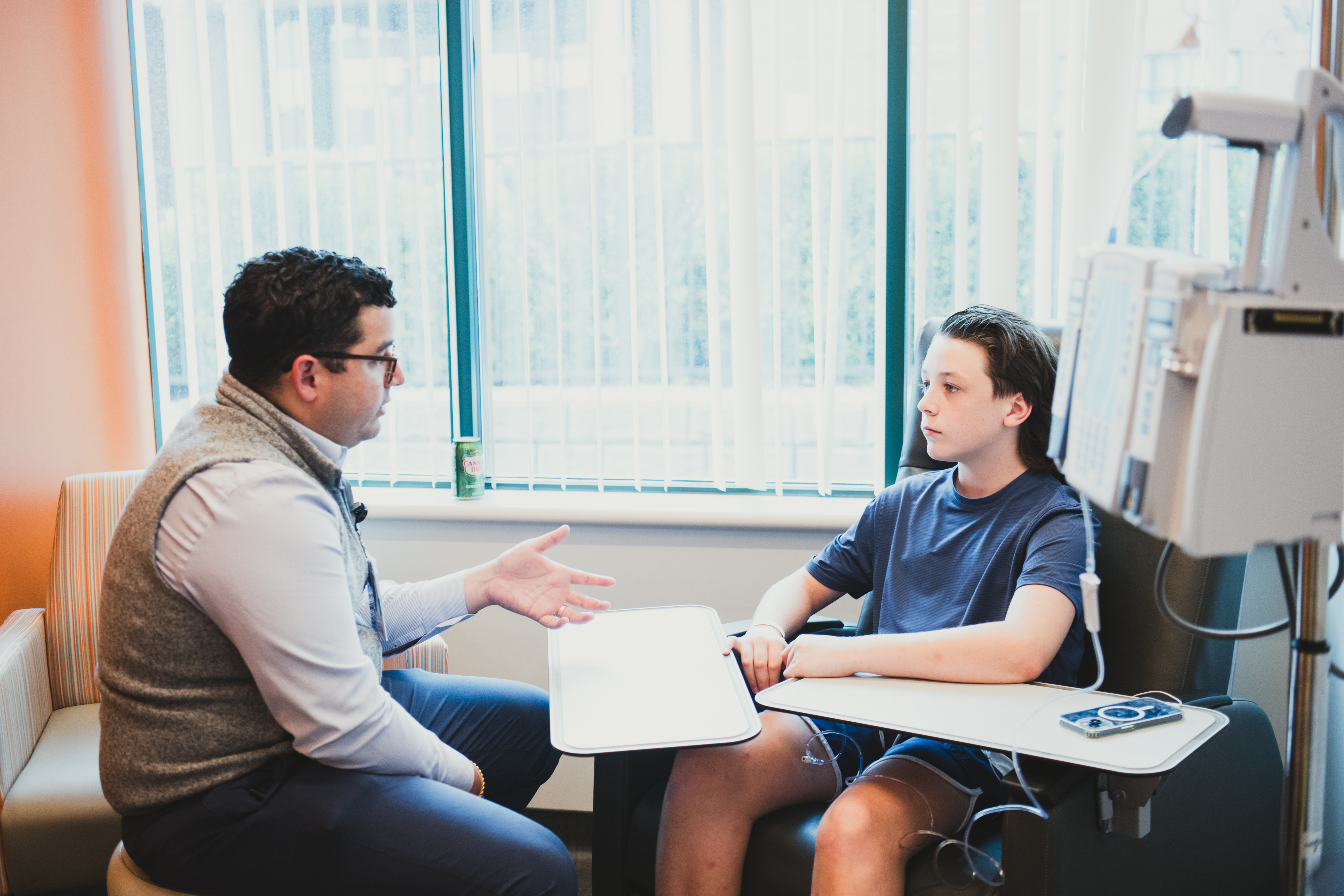 Dr. Salazar speaking with a patient