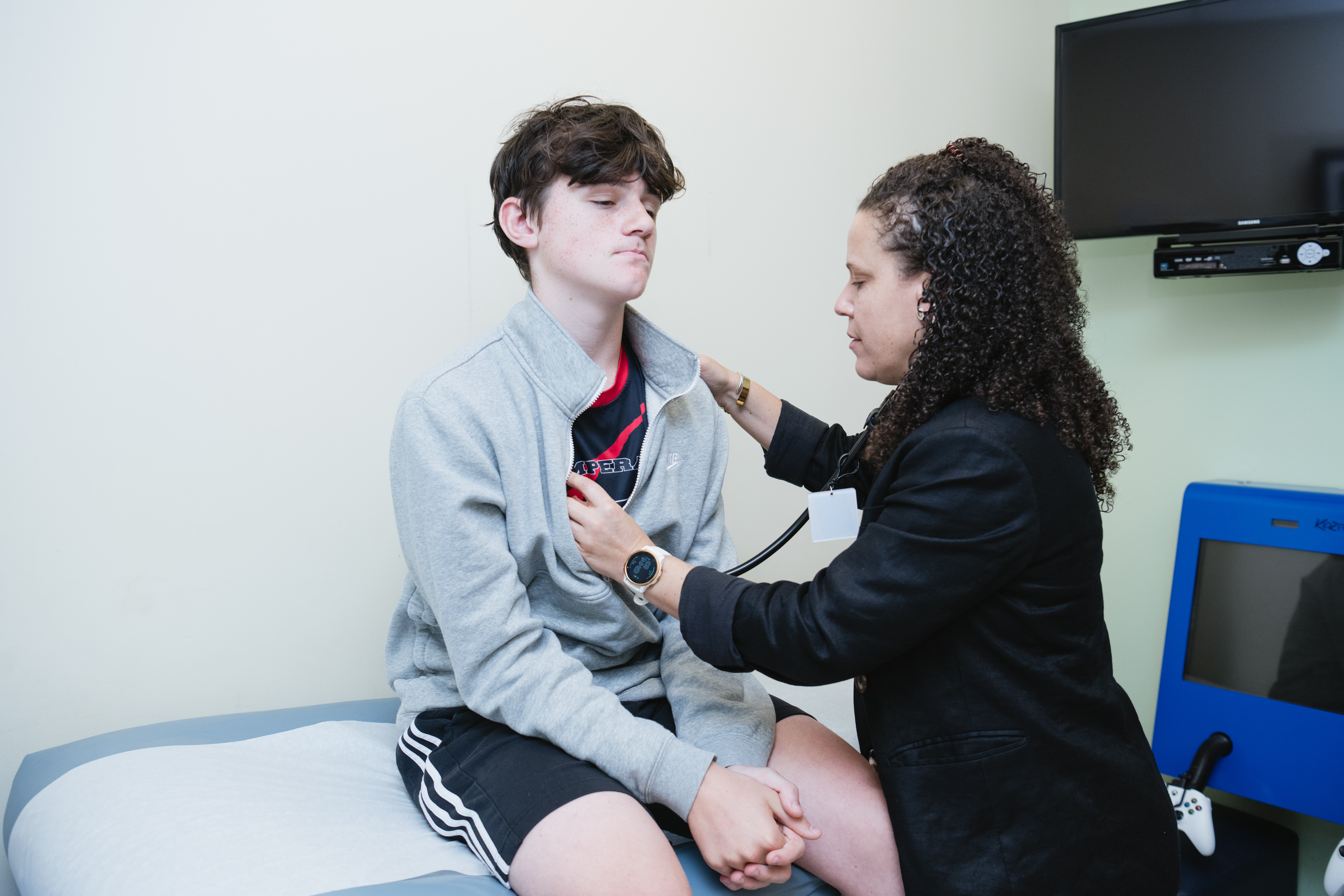 Doctor Gell taking vitals on a patient