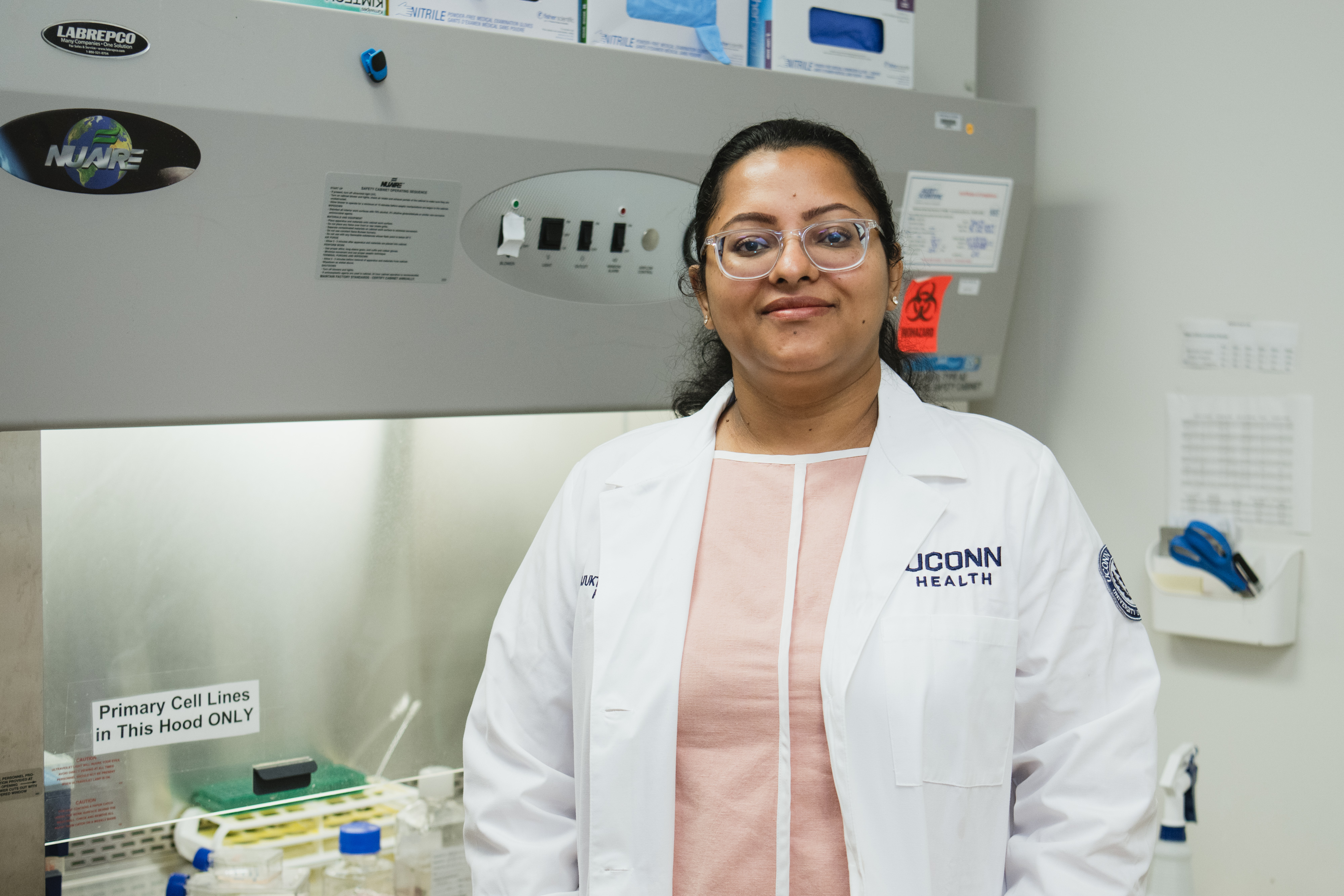 Dr. Majumder smiling in the lab