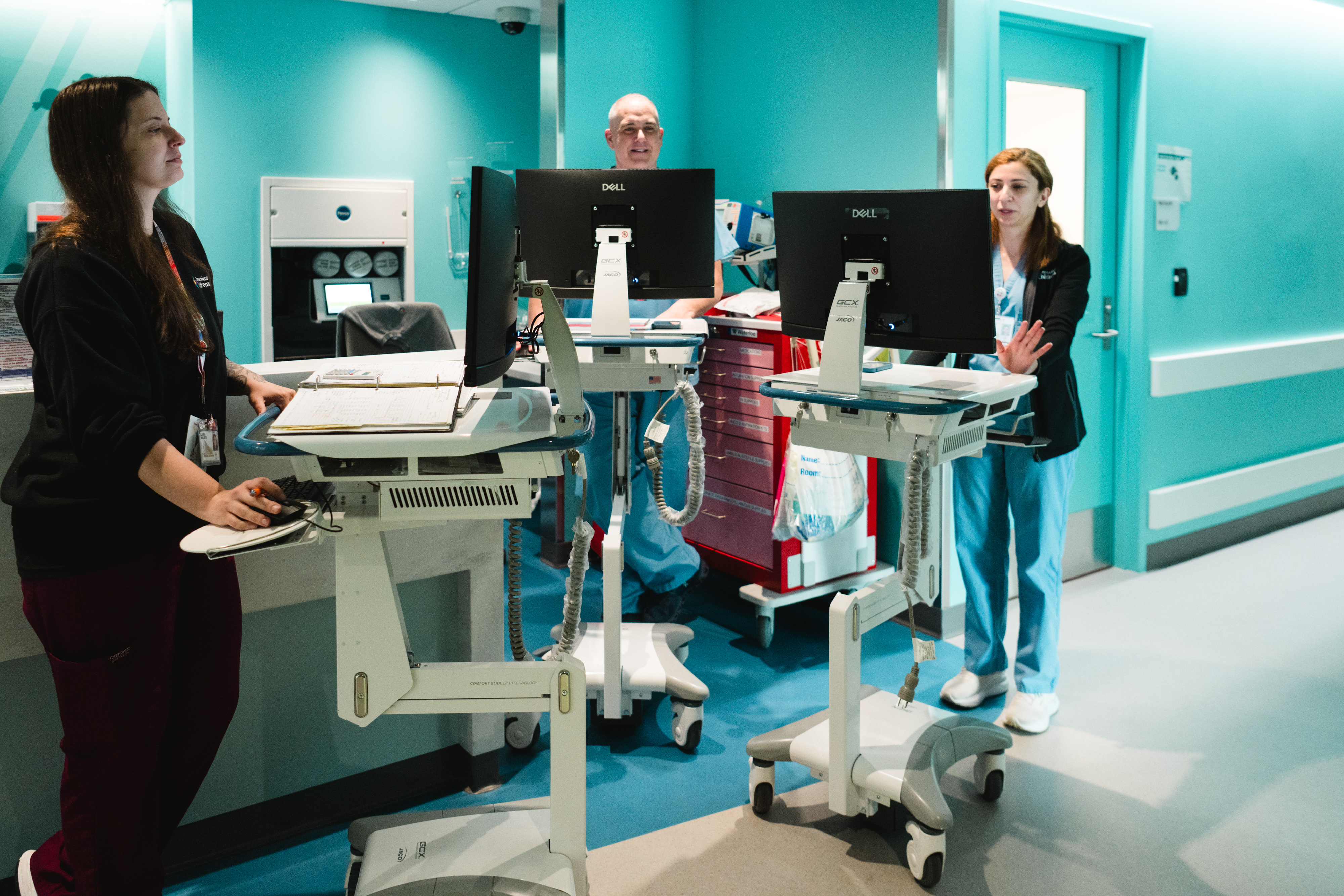 Neonatologist Hala Saneh, MD, physician assistant James Gerace, PA-C, and clinical dietitian Laura Willets, RD, CSP, are in the middle of morning rounding in the NICU