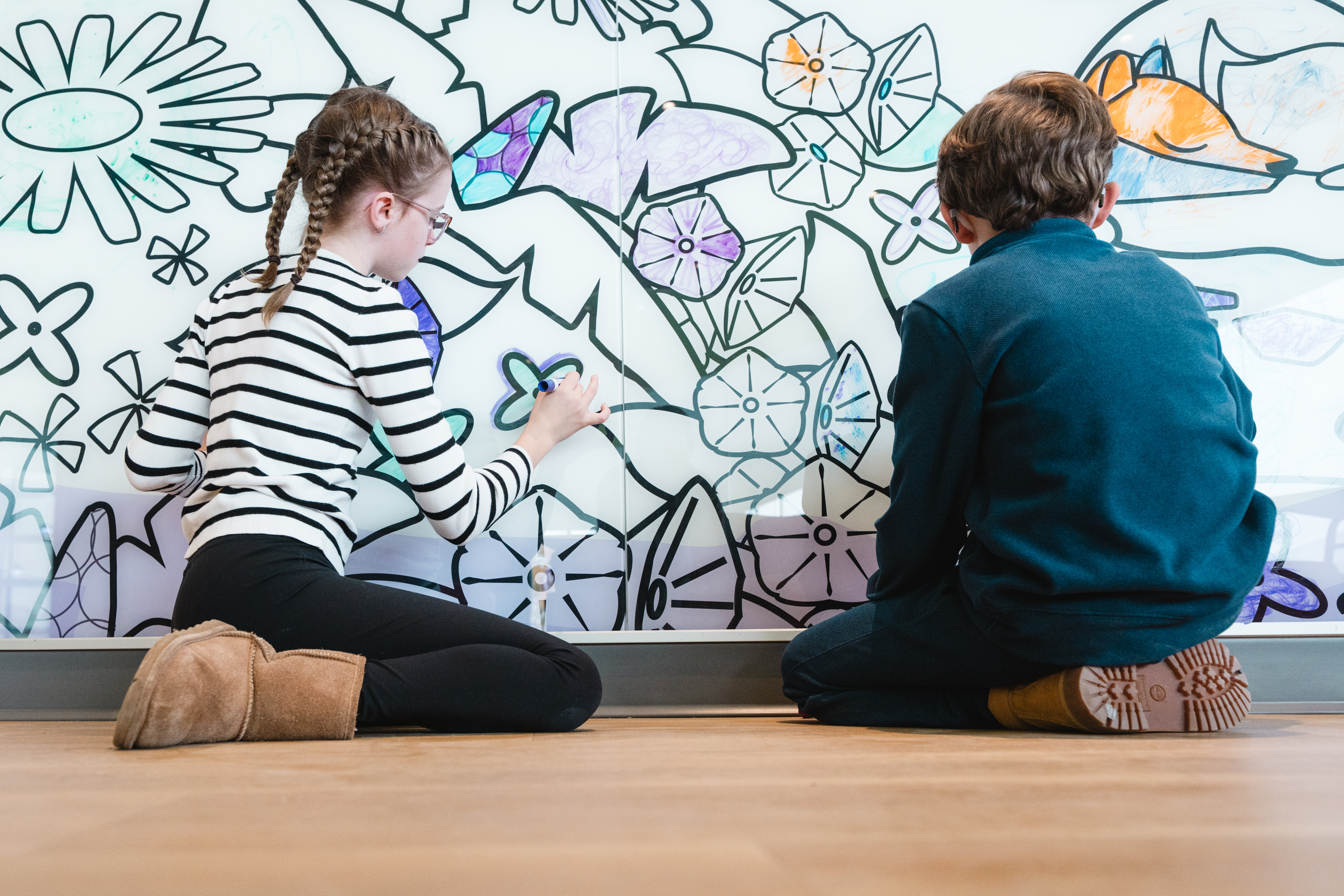 siblings can hang out in the Fetal Care Family Lounge and pass the time by coloring our fun Wayfinding Friends on the wall.