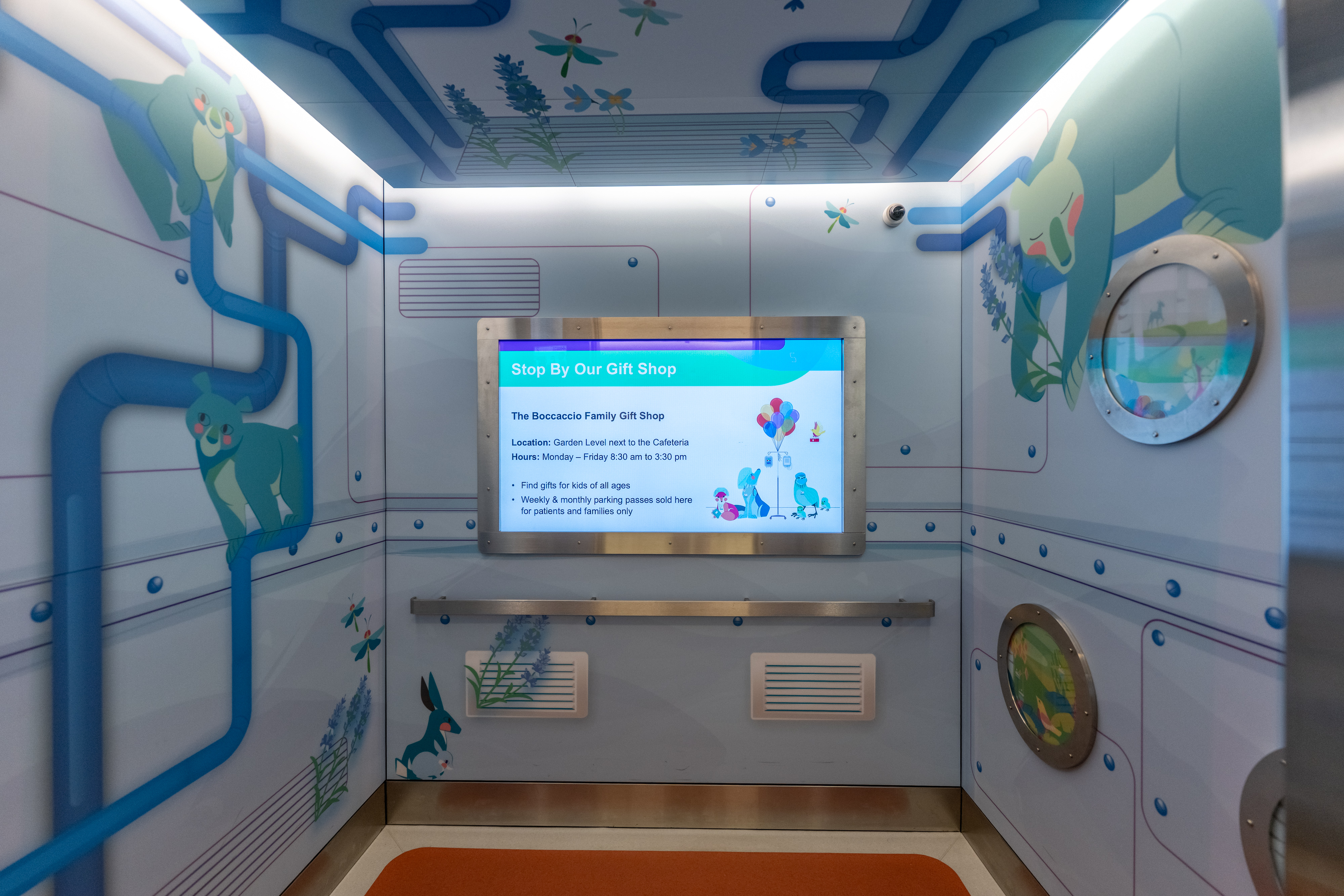 Tower elevator with fun, fishy wayfinding friends