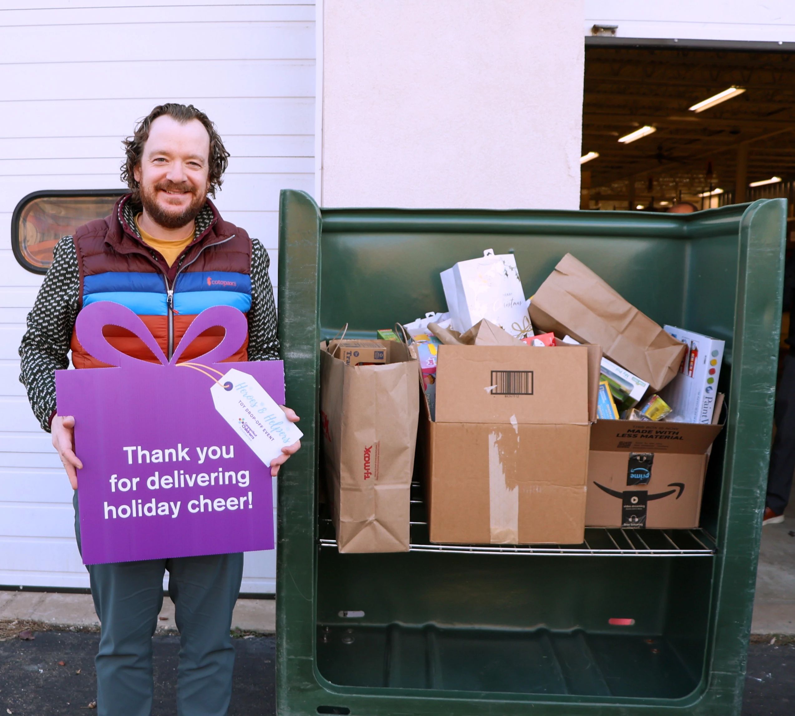 Business owner dropping toys off at the in person event