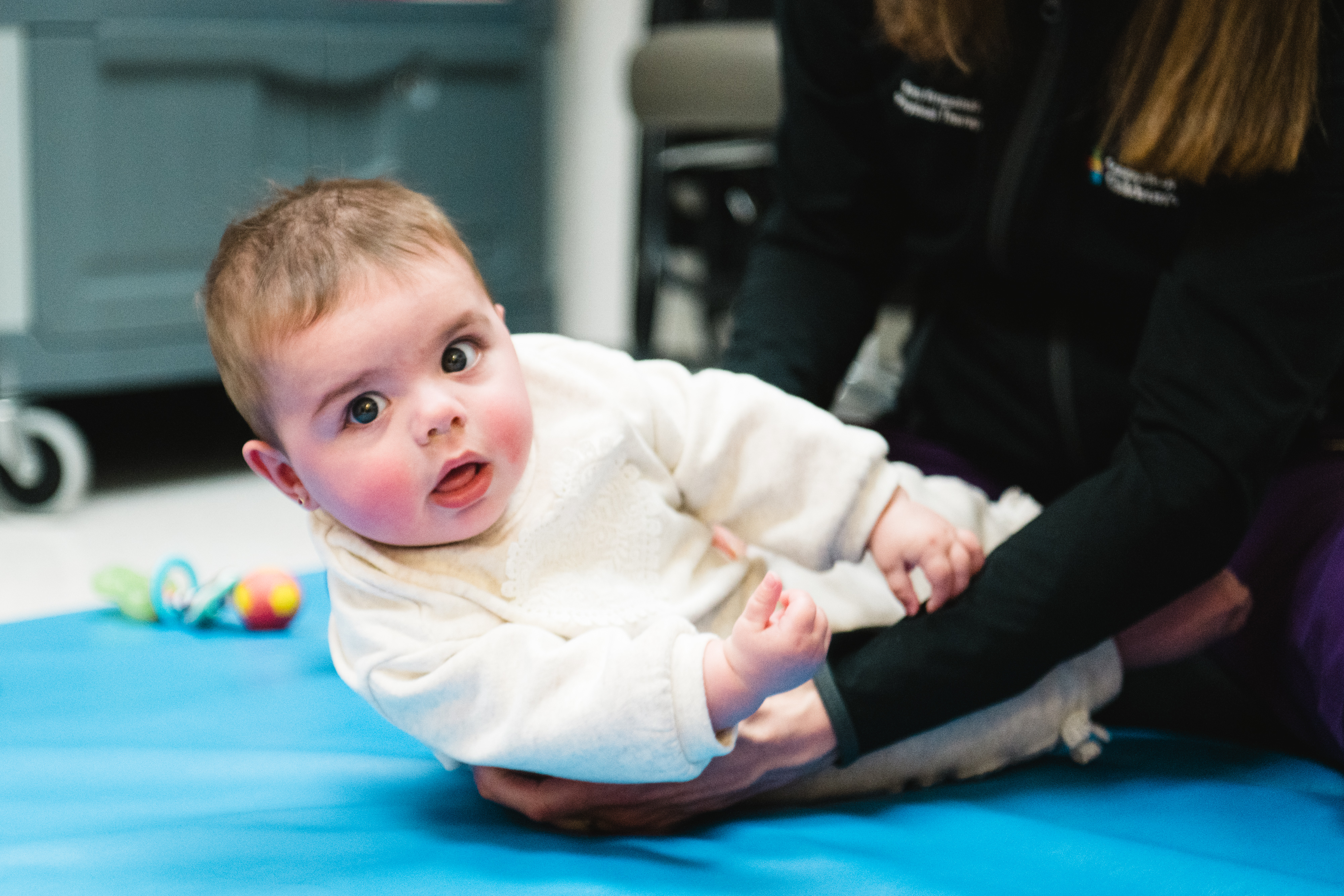 Baby receiving physical therapy services