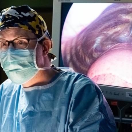 Surgeon and image of heart