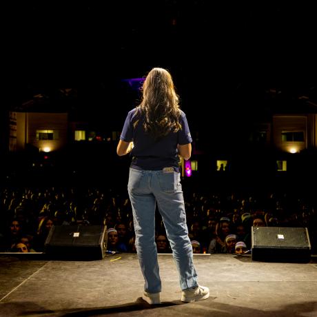 Alyssa Piccoli, student Executive Director stands on stage
