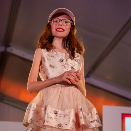 Zofia in a dress in a fashion show