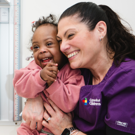 Smiling child with care provider