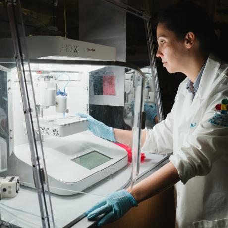 Dr. Rowe in the research lab conducting research using the 3D Bioprinter