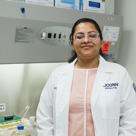 Dr. Majumder smiling in the lab