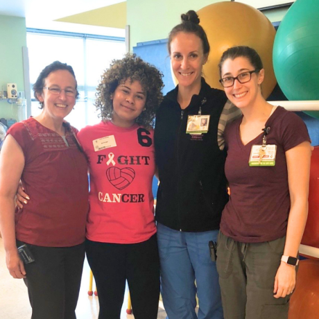 Evelyn smiling with her care team