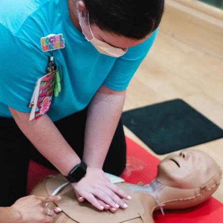 Caregiver practicing CPR
