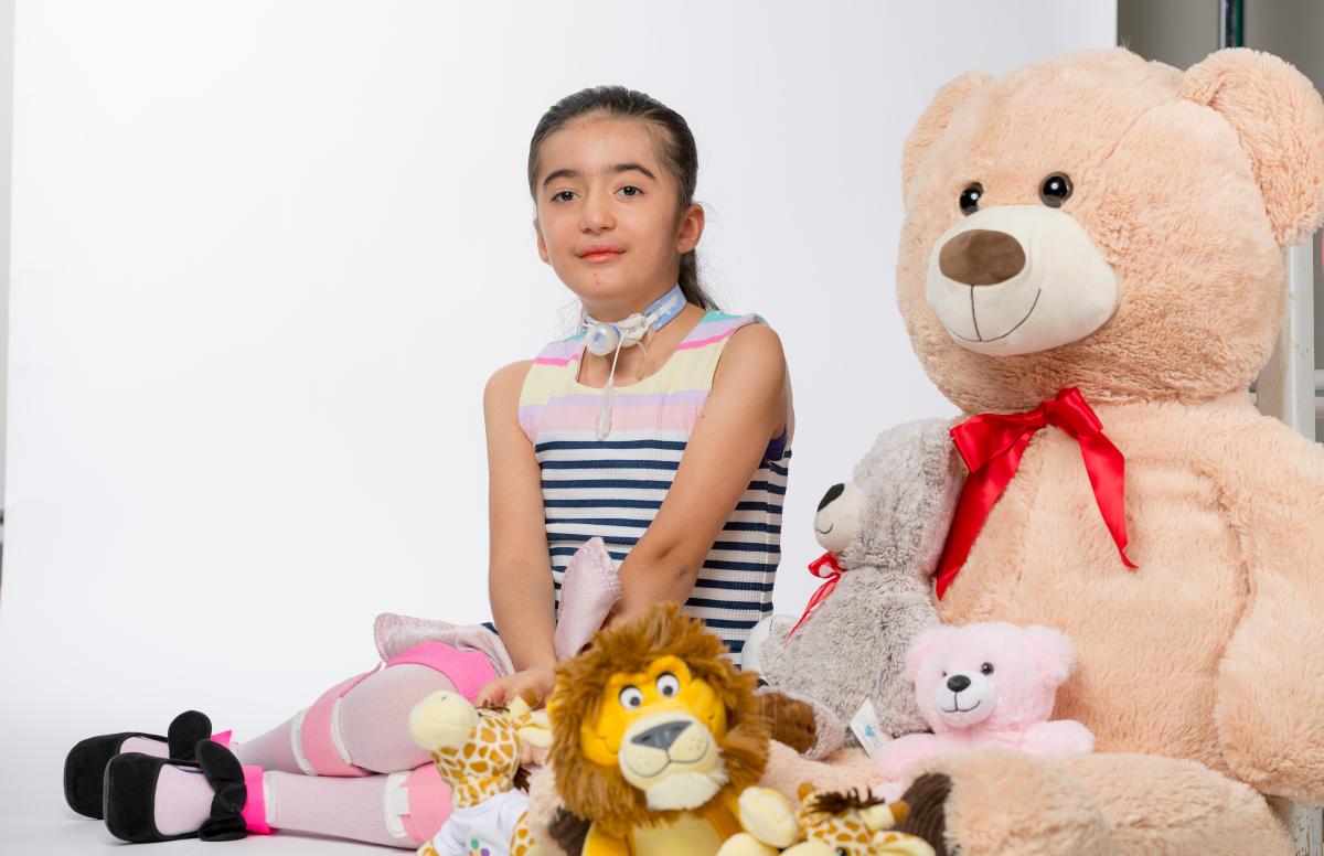 Ariella with stuffed animals