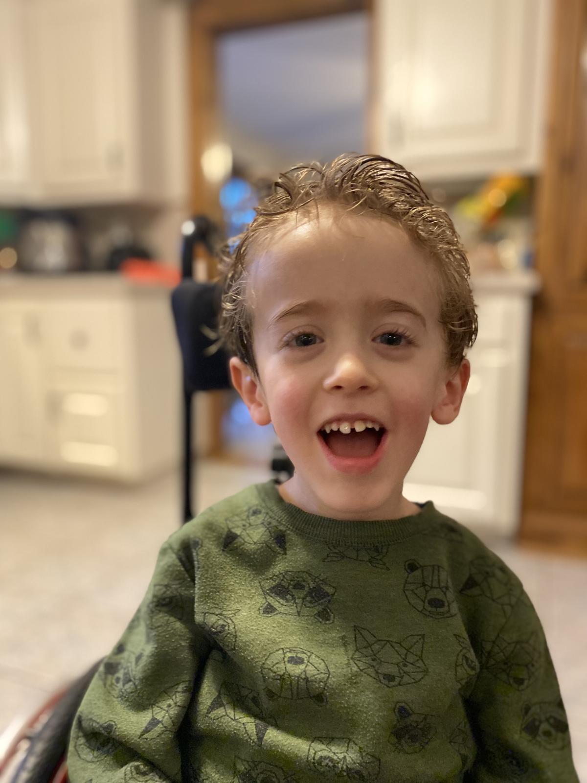 Carter Smiling with Slicked Back Hair