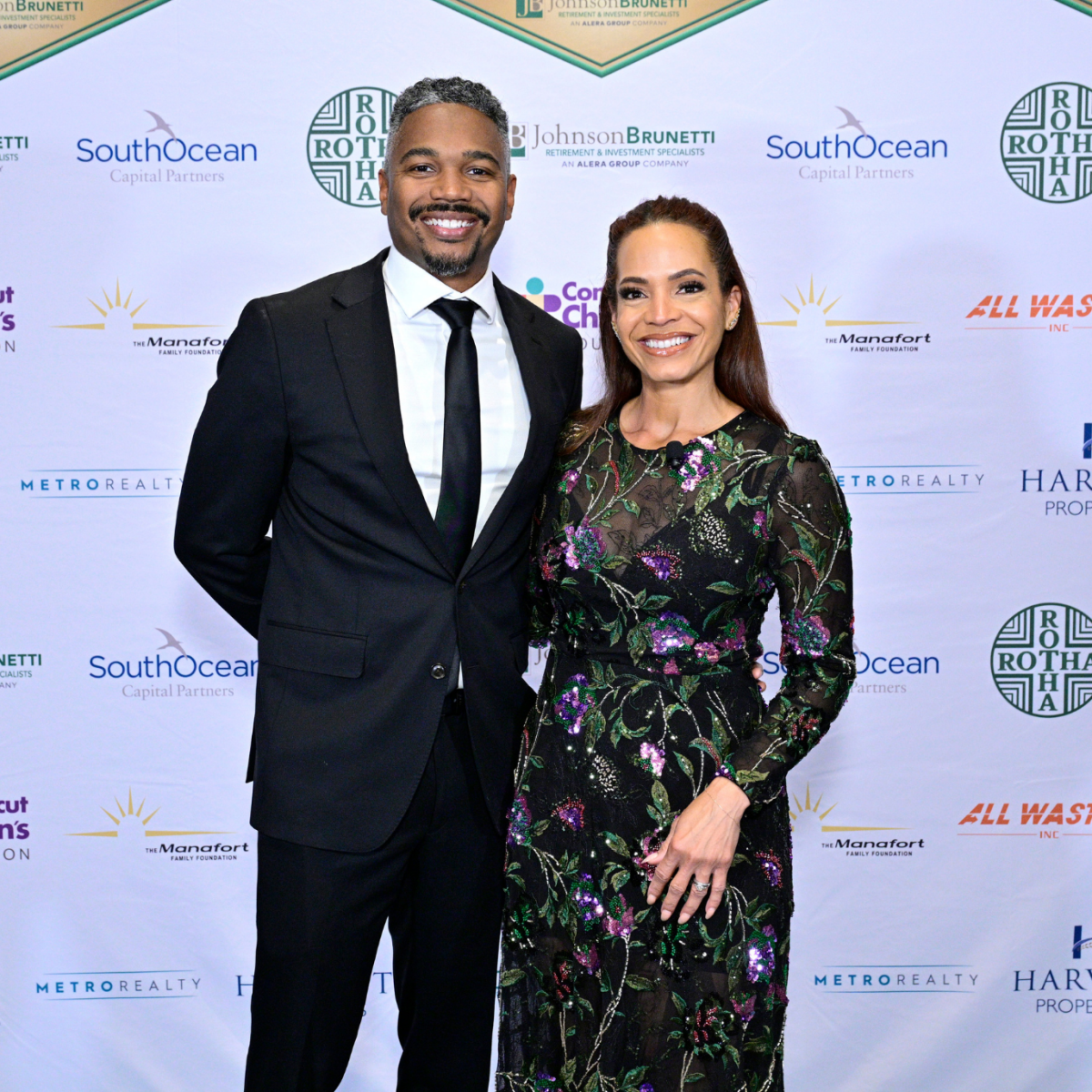 Elle Duncan smiling with her partner