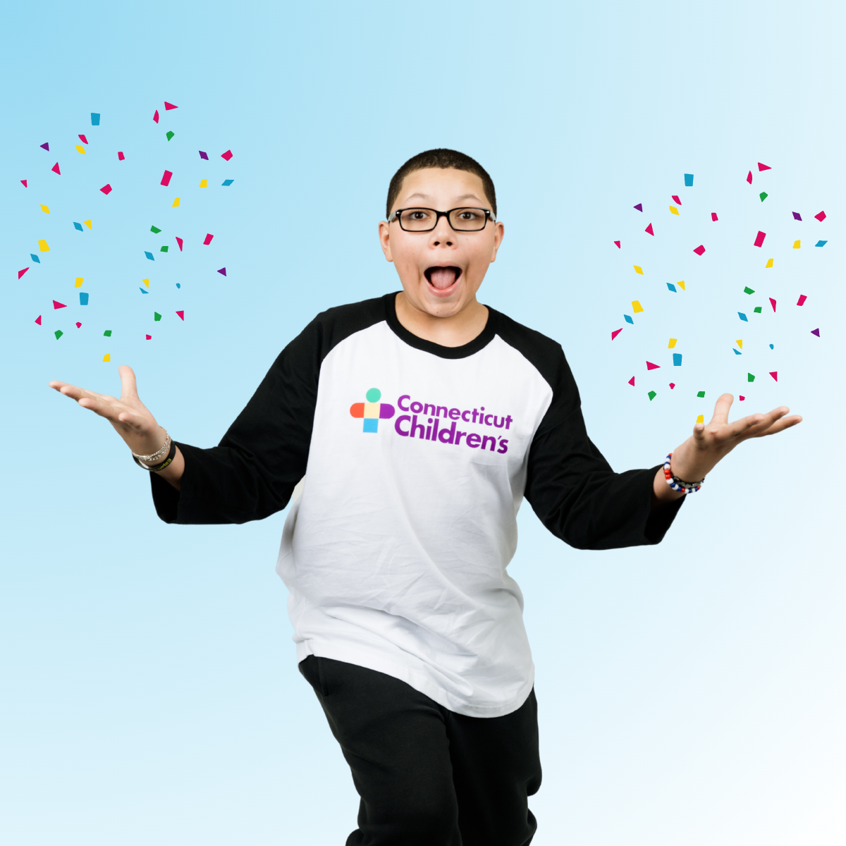 Patient Elijah making a shocked face with confetti