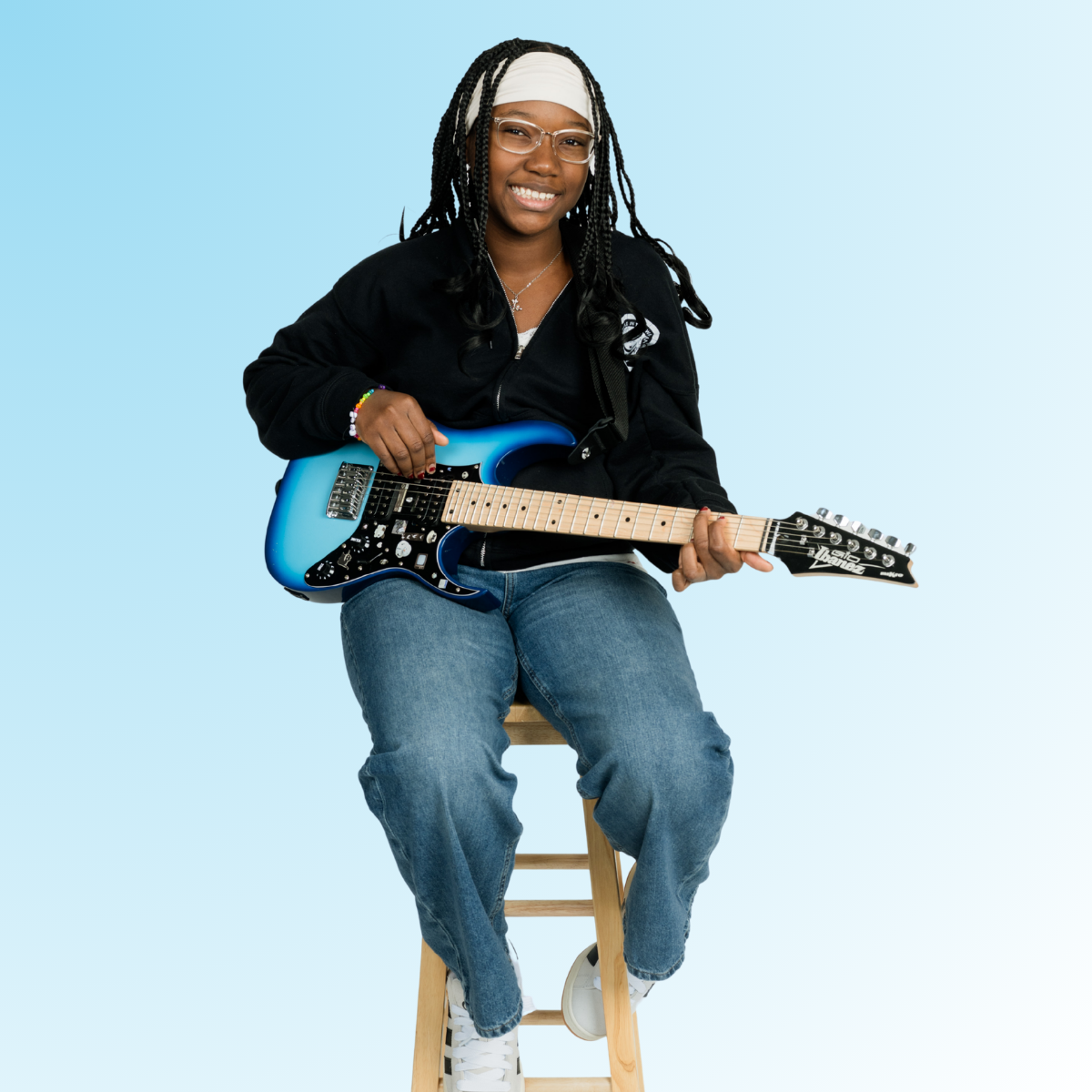 Zendaya playing the guitar