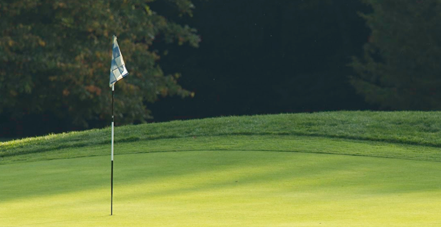 Golf course with hole flag