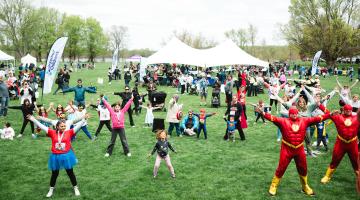 Kids doing yoga at community bash